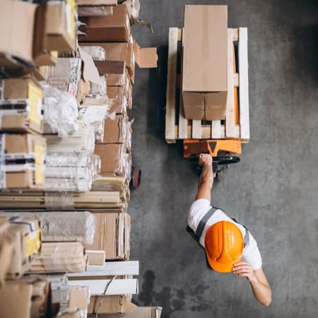 young-man-working-at-warehouse-with-boxes (1)